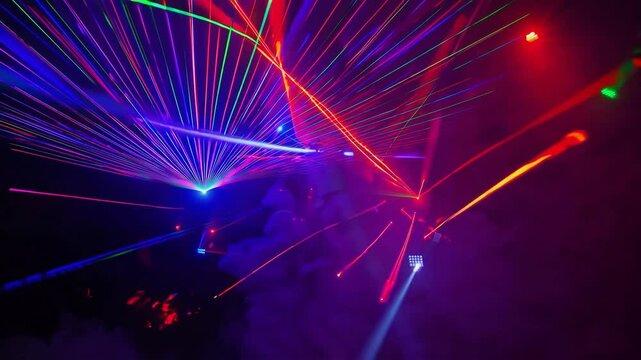 Vivid Laser Light Show Glowing Through Colorful Smoke Creating Mesmerizing Abstract Patterns in Night Sky