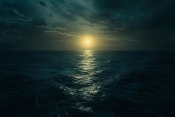 Fototapeta premium dark ocean with the sun setting on one side, casting long shadows across its surface.