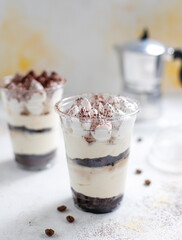Traditional italian desert tiramisu in a jar.