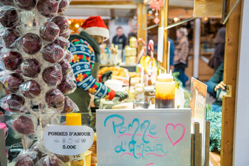 Festive market stall with treats and holiday spirit in cozy winter atmosphere