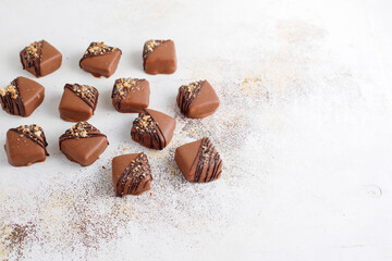 Handmade chocolate with pistachios, dark and milk chocolate pieces.
