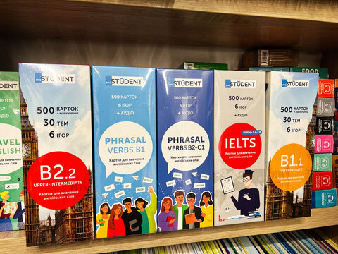 Lviv, Ukraine - February 13, 2025: Language learning flashcards displayed on a store shelf for different proficiency levels