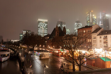 Fototapeta premium Cityscape with illuminated buildings, bridge, and Ferris wheel at night