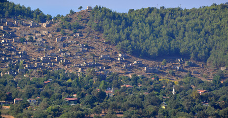 Historical Kayakoy, located in Fethiye, Turkey, is an old Greek settlement with abandoned houses and churches.