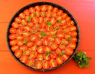 Sun-dried cherry tomatoes on a round tray