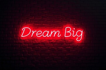 glowing red neon sign against a wall background with the text dream big