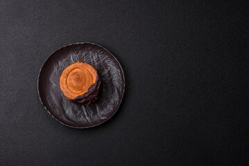 Round sweet New York roll croissant with chocolate cream filling