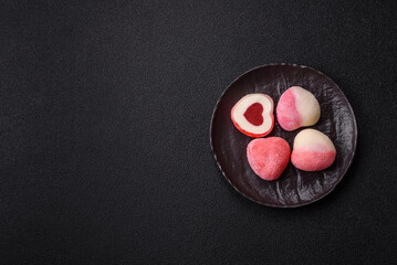 Delicious sweet mochi in the shape of red hearts