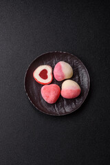 Delicious sweet mochi in the shape of red hearts