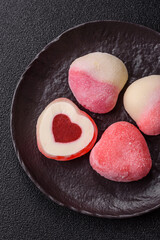 Delicious sweet mochi in the shape of red hearts