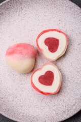 Delicious sweet mochi in the shape of red hearts