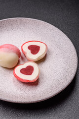 Delicious sweet mochi in the shape of red hearts