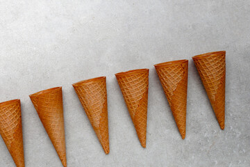 Waffle cones on grey background