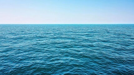 Obraz premium Sparkling Blue Ocean Surface Under Clear Sky