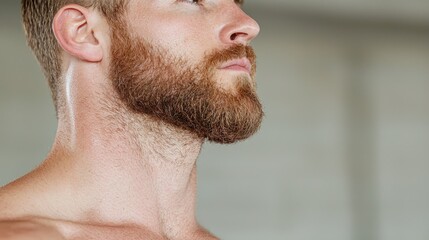 Obraz premium Man's profile, beard, gym background, fitness