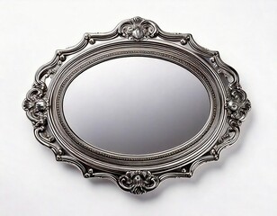 Decorative ornate silver mirror hanging on a wall with intricate carvings