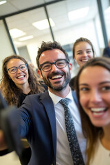 A man and three women are smiling for a picture