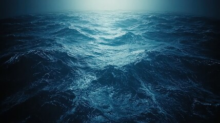 Dark ocean waves with distant bright horizon creating a calming, peaceful scene
