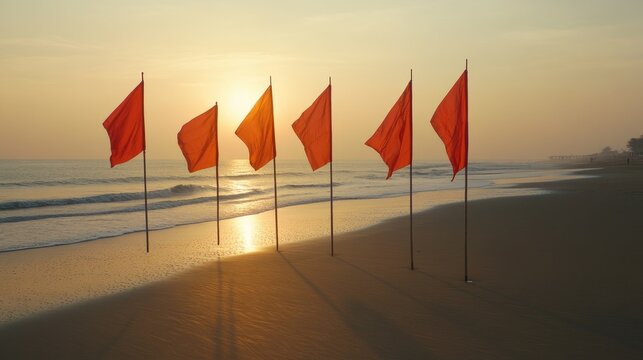 Brightly lit feather flags casting distinct shadows on smooth, untouched beach sand