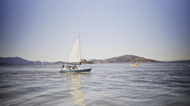 Sailboat Gliding Across the Pacific Ocean with Alcatraz Island in the Background &ndash; San Francisco