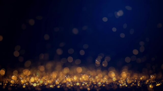 Fondo abstracto azul oscuro con part&iacute;culas doradas brillantes y en movimiento, efecto bokeh. Video en bucle.