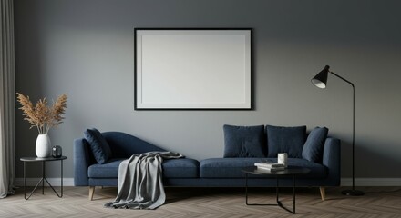 Dark moody interior, blue velvet sofa, concrete walls, minimalist living room, large white canvas, black floor lamp, round coffee table, dried palm leaf, cozy throw blanket, muted color palette, empty