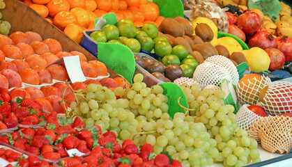 Colorful fruits pile outside on a market