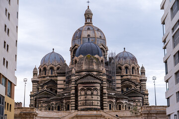 Marseille, France, February 2, 2025: A view of La Major Cathedral (Marseille Cathedral) taken from a modern city street framed by contemporary buildings.