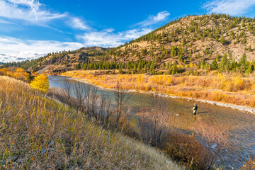 A man fly fishes in the Clark Fork river in the Missoula region near Lolo National Forest, in...