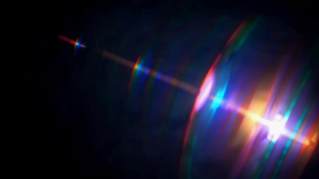 Colorful lens flare and light effect on dark background. Optical glare phenomenon, vibrant abstract concept