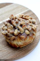 Butterscotch bread with raisin filling, topped with caramel-coated cashew nuts.