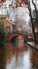 Naklejka premium Autumnal Canal Scene Brick Bridge Old Town Houses