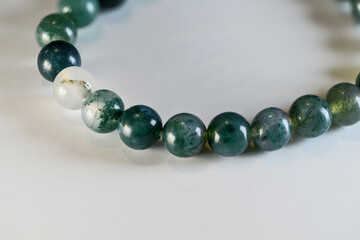 Bracelet with moss agate balls.