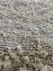 A close-up photo of the initial blending process of sponge (cotton) used for making beds. The soft,...