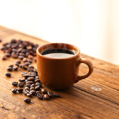 Fototapeta premium A steaming cup of hot coffee on a rustic wooden table with scattered coffee beans. Generative AI