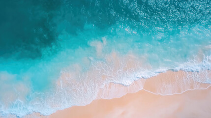 Fototapeta premium Aerial view of a beautiful sandy beach by the ocean with crystal clear turquoise water