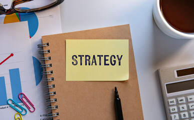 There is sticky note with the word Strategy. It is as an eye-catching image.
