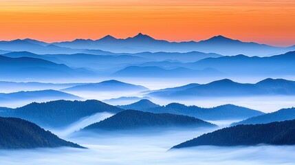 Fototapeta premium Misty mountain range at sunrise. Possible use Nature backdrop