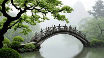Fototapeta premium Serene Stone Bridge Misty Asian Garden Tranquil Pond Lush Greenery
