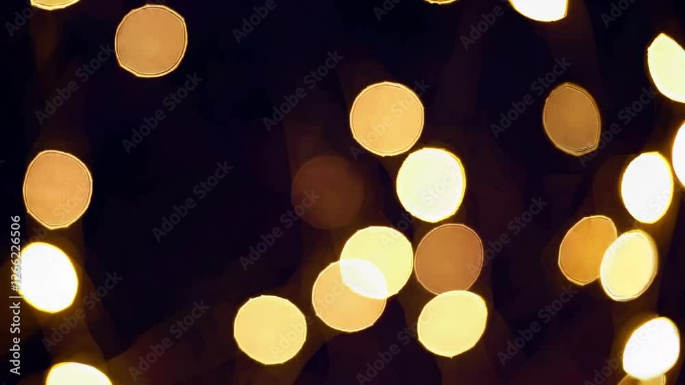 Poster glowing bokeh lights on a dark background, festive and abstract concept