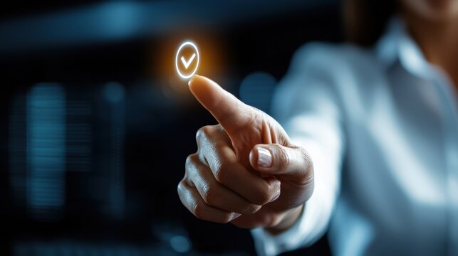 A woman is pointing at a glowing check mark on a screen