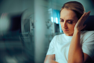 Woman Suffering from an Ear Ache Feeling in Pain. patient feeling sick having otitis symptoms in...