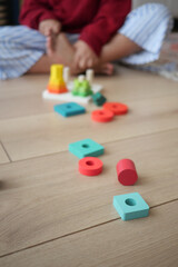 Colorful Wooden Toys Arranged on a Light Wooden Floor