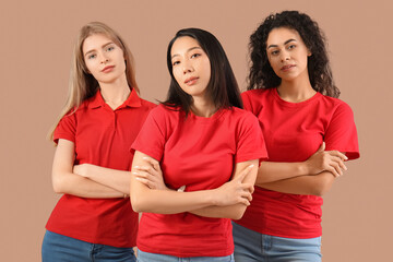 Beautiful young women on beige background. Women history month