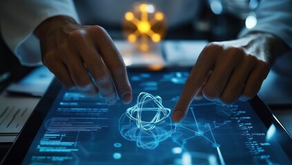 Scientist's hands interacting with a digital atom model on a tablet.