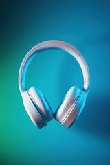 White over-ear headphones on teal background.