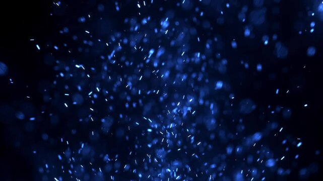 Blurred bokeh motion picture of animation Flying around blue fire dust particles sparks or ember from a burning fire with realistic movement. on a black background	