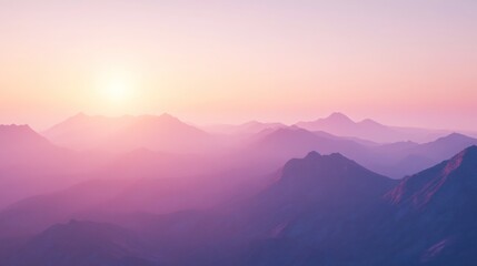 Fototapeta premium Soft pink and purple sunset over a mountain range.