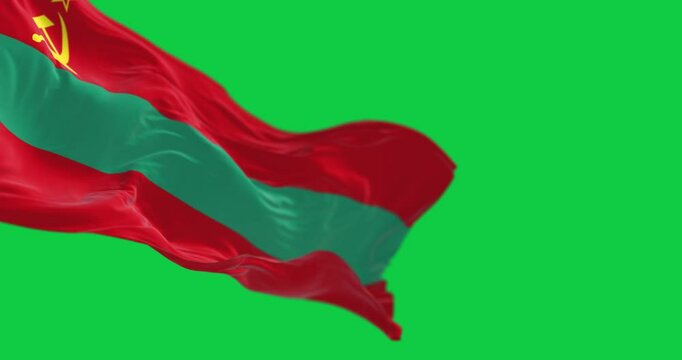 Close-up of national flag of Transnistria waving isolated on green background