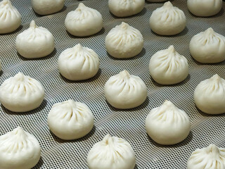many steamed Baozi in steamer. traditional Chinese food